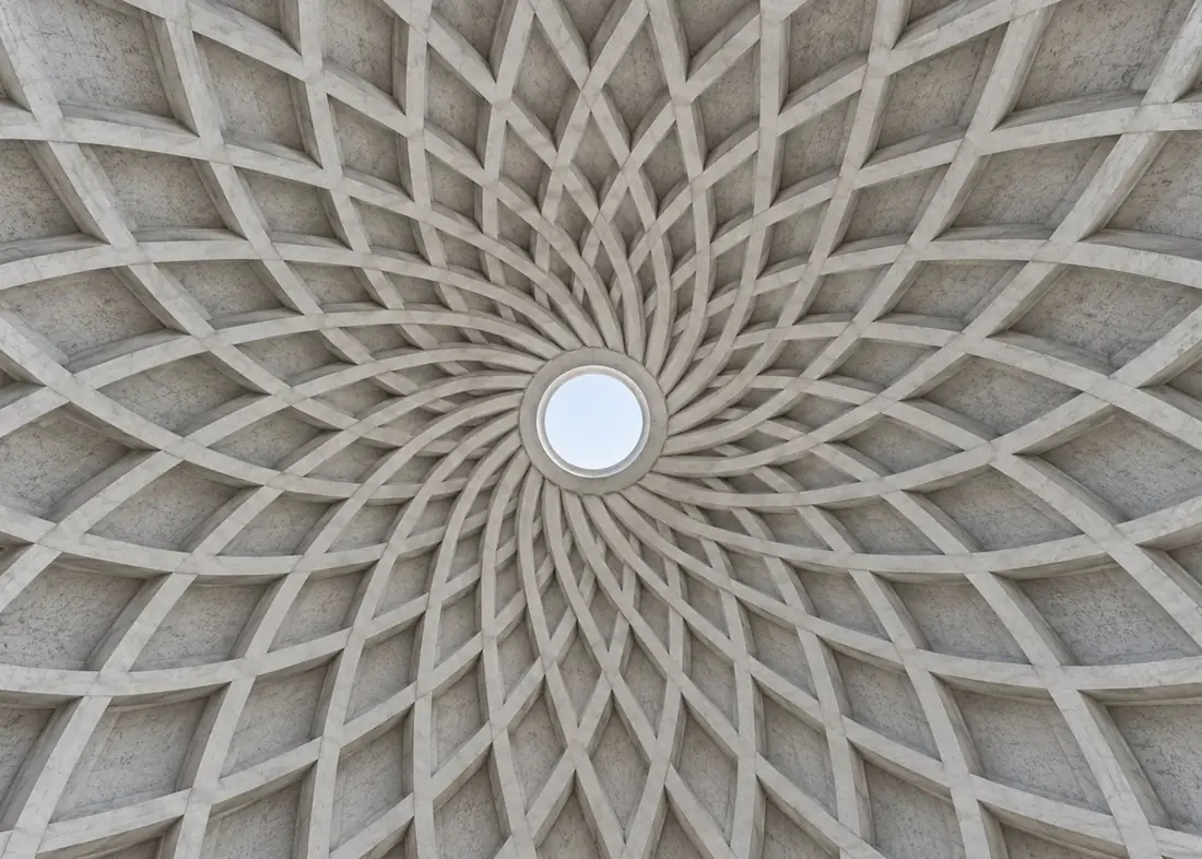 Ribbed concrete dome seen from below, open at its centre